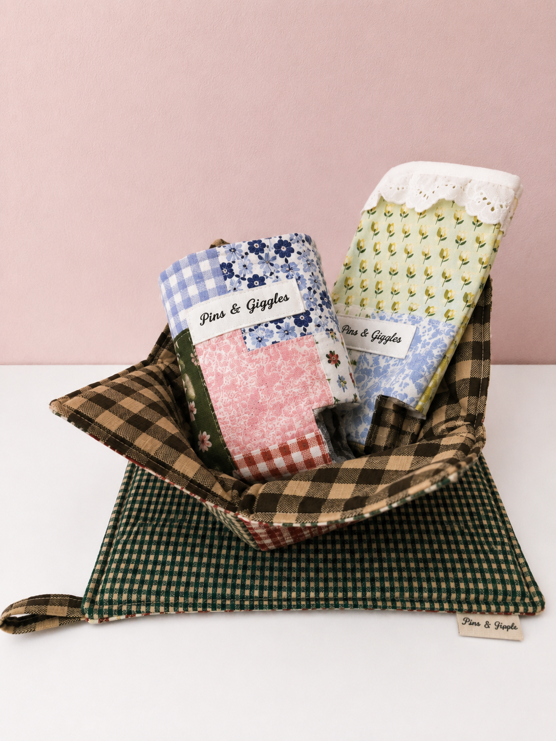 A bundle of kitchen items: can coozies, a bowl cozy, and a potholder all together to showcase the type of collection