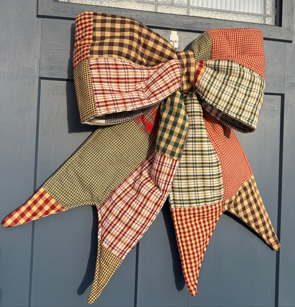 Decorative plaid bow on a blue door