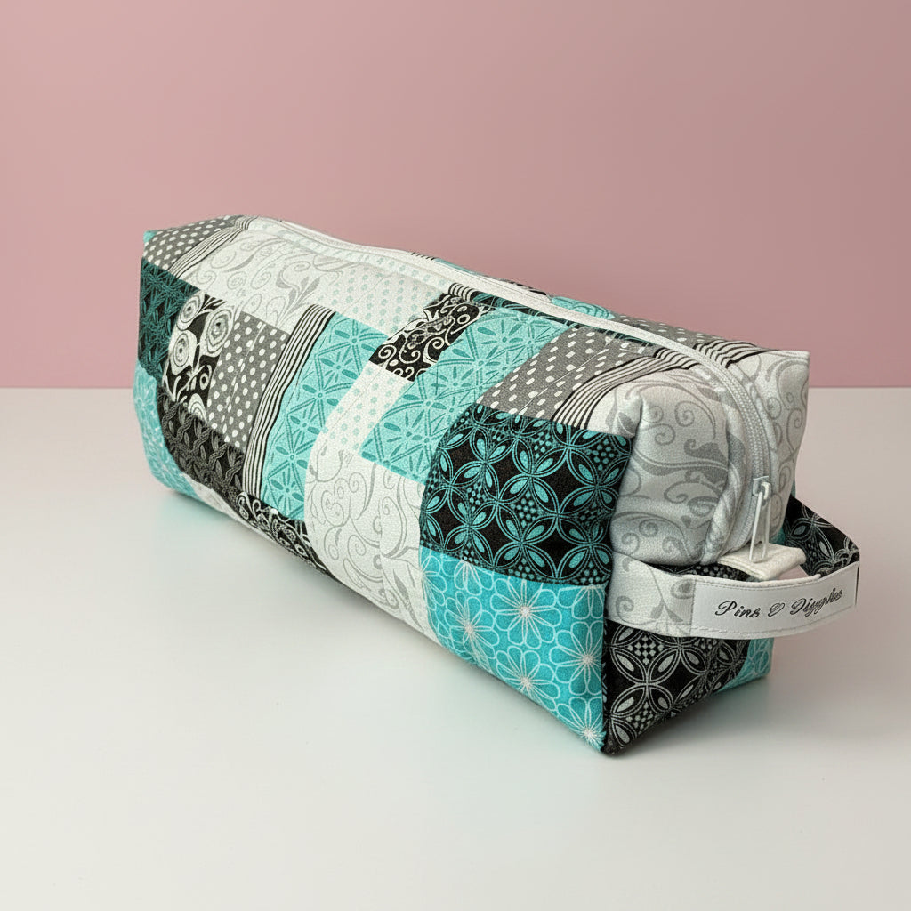 Hair tool bag with blue and grey patchwork fabric.