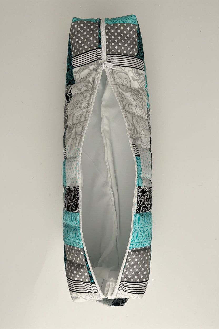 Hair tool bag with blue and grey patchwork fabric, opened with a white interior.