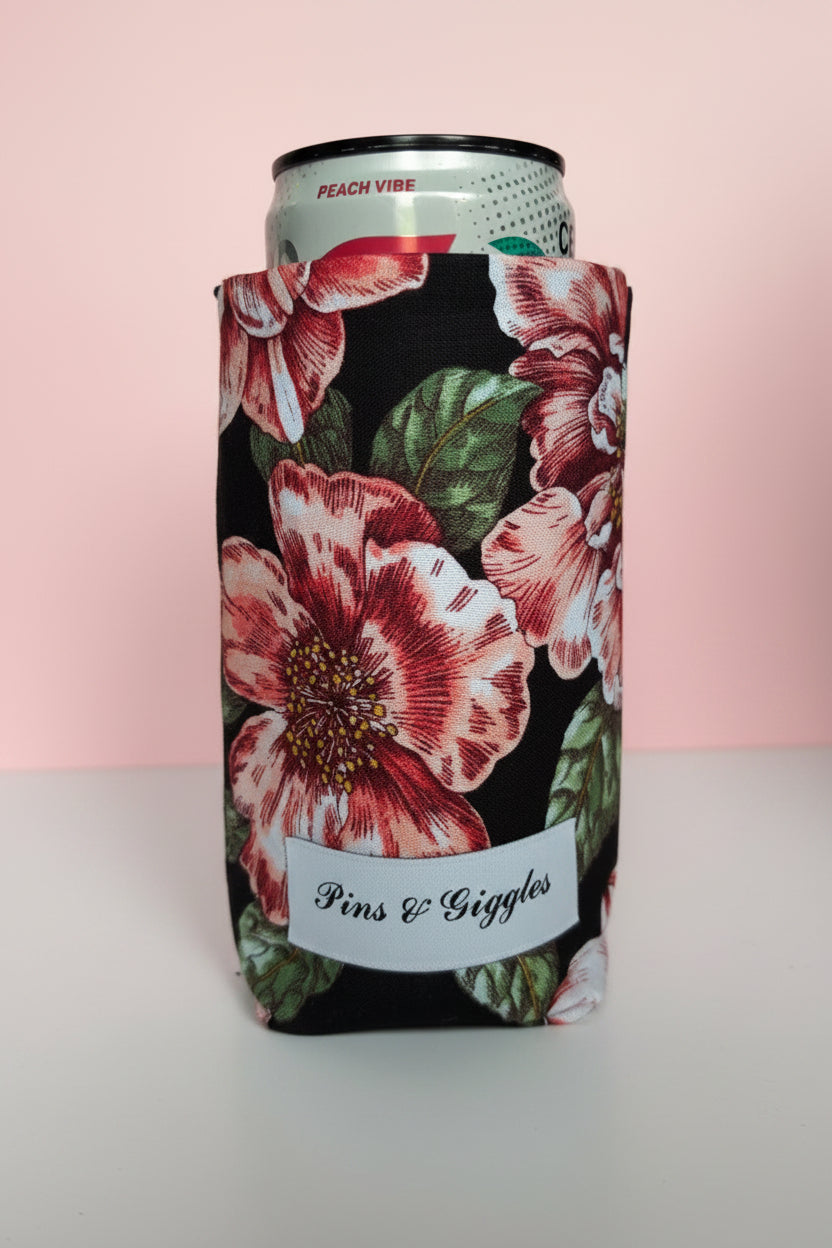 Can cooler with floral design cooler on a white surface with pink background