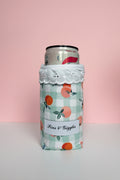 Can cooler with peach pattern on a pink background
