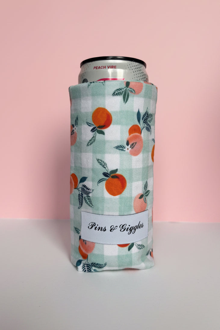 Can with a peach and checkered design on a white surface with a pink background