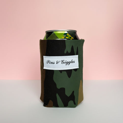 camouflage can cooler with a label on a pink background
