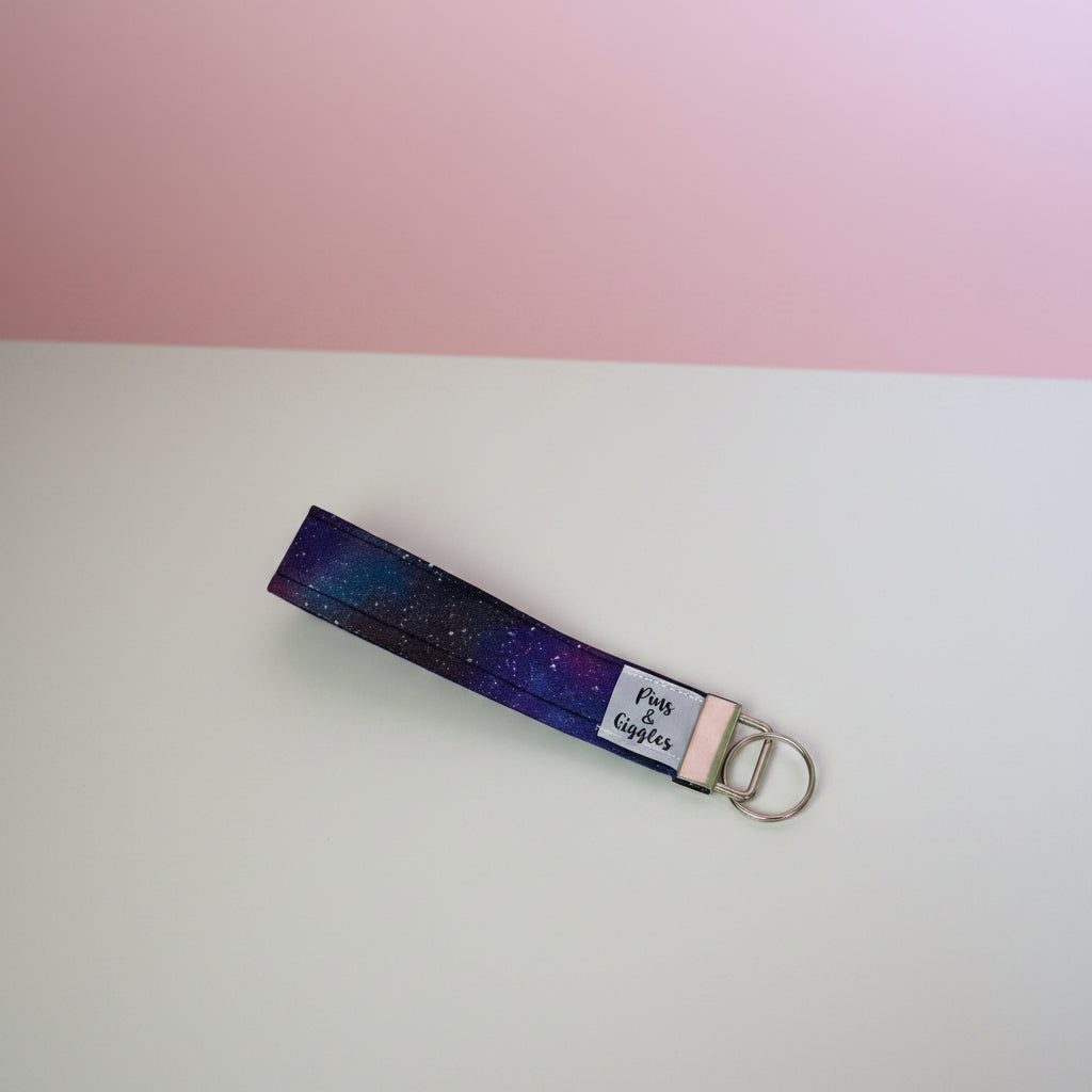 Keychain with starry design on a white surface
